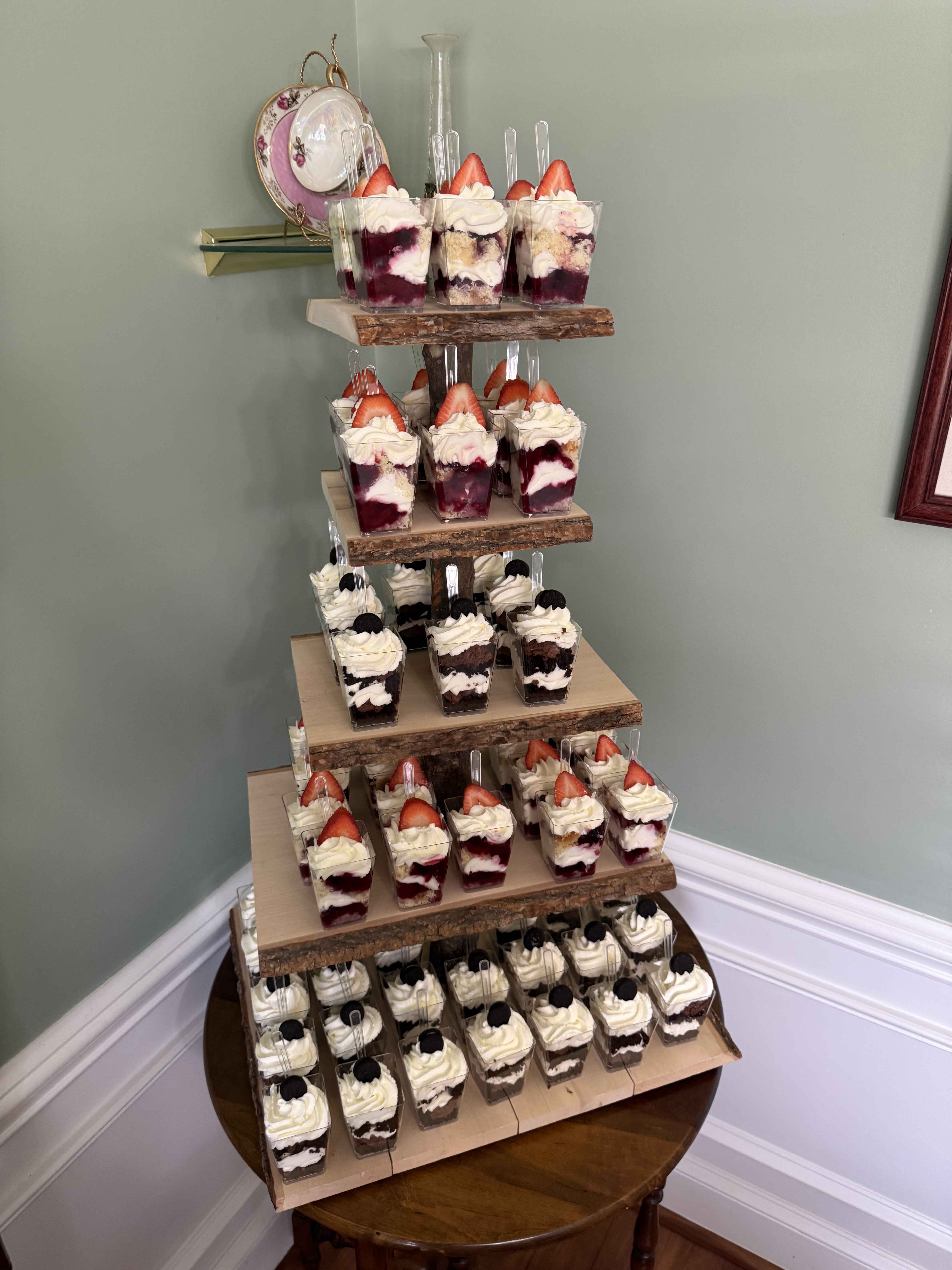 Elegant two-tiered parfait display with strawberry and chocolate varieties